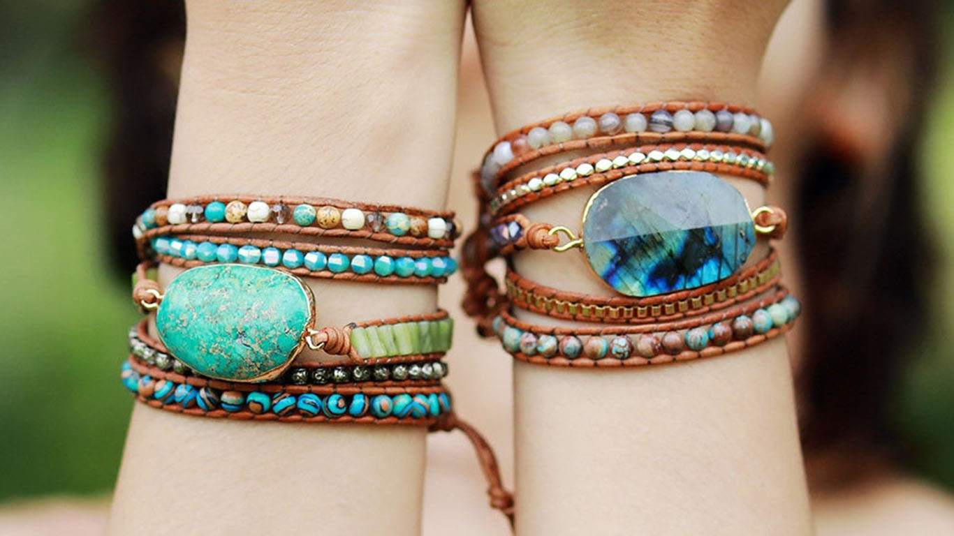Two beaded wrap bracelets worn side by side